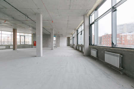 empty pure commercial office building undecorated in gray colors.open space officeの写真素材