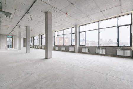 empty pure commercial office building undecorated in gray colors.open space office