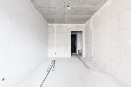interior of the apartment without decoration in gray colors. rough finish