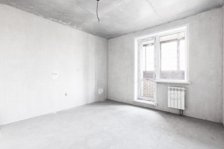 interior of the apartment without decoration in gray colors. rough finishの写真素材