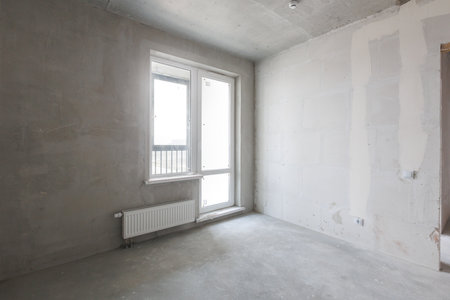 interior of the apartment without decoration in gray colors. rough finishの写真素材