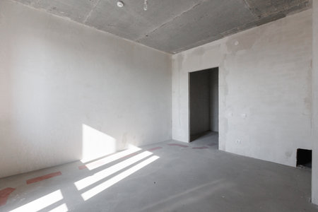 interior of the apartment without decoration in gray colors. rough finishの写真素材