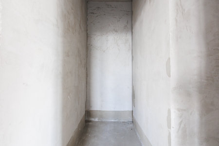 interior of the apartment without decoration in gray colors. rough finishの写真素材