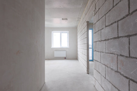 interior of the apartment without decoration in gray colors. rough finishの写真素材