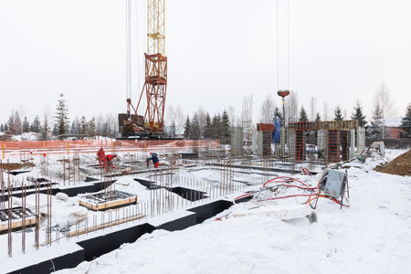 the construction site of an apartment building in the winter from a height