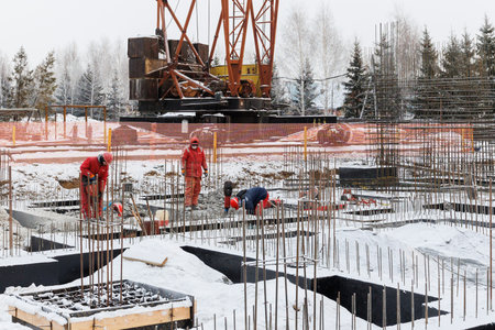 the construction site of an apartment building in the winter from a heightの写真素材