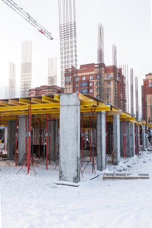 the construction site of an apartment building in the winter from a height
