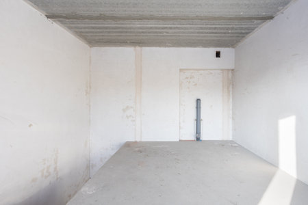 interior of the apartment without decoration in gray colors. rough finishの写真素材