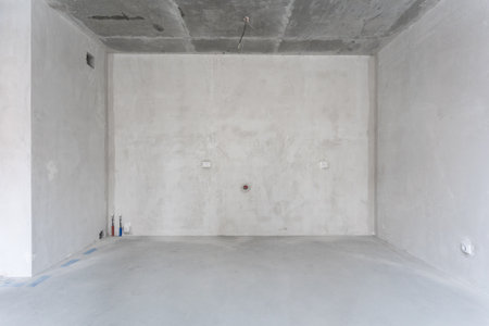 interior of the apartment without decoration in gray colors. rough finishの写真素材