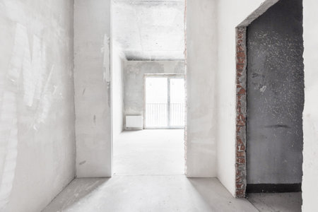 interior of the apartment without decoration in gray colors. rough finishの写真素材