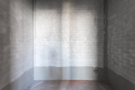 interior of the apartment without decoration in gray colors. rough finishの写真素材