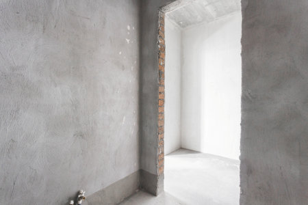 interior of the apartment without decoration in gray colors. rough finishの写真素材
