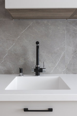 kitchen faucet on a stylish metal sink