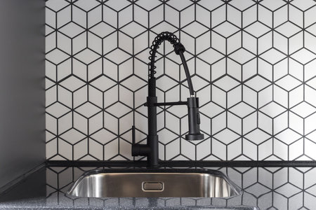 kitchen faucet on a stylish metal sink