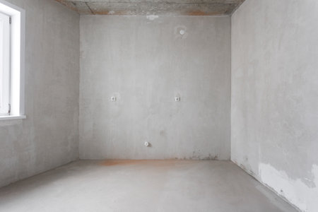 interior of the apartment without decoration in gray colors. rough finishの写真素材