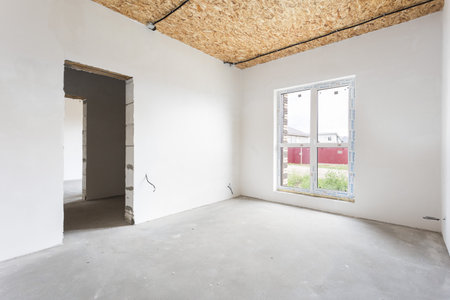 interior of the apartment without decoration in gray colors. rough finishの写真素材