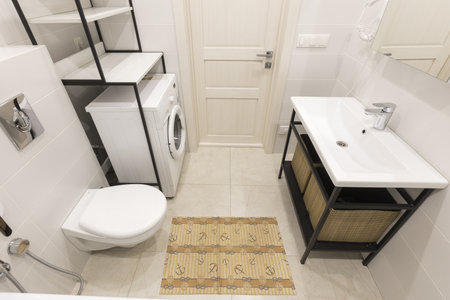 modern bathroom room with toilet and washing machine