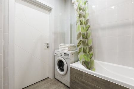 modern bathroom room with toilet and washing machine