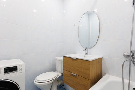 modern bathroom room with toilet and washing machine