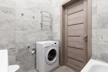 modern bathroom room with toilet and washing machineの写真素材