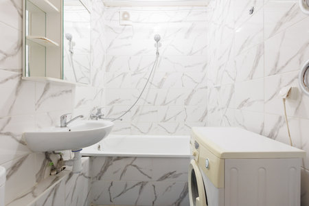 modern bathroom room with toilet and washing machine