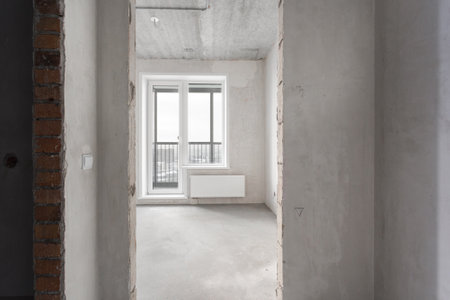 interior of the apartment without decoration in gray colors. rough finishの写真素材