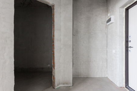 interior of the apartment without decoration in gray colors. rough finishの写真素材