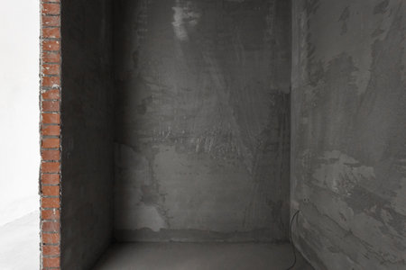 interior of the apartment without decoration in gray colors. rough finishの写真素材