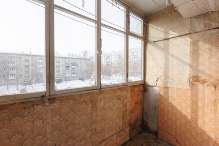 the balcony of an apartment on the upper floors of an apartment buildingの写真素材