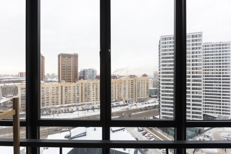 the balcony of an apartment on the upper floors of an apartment building