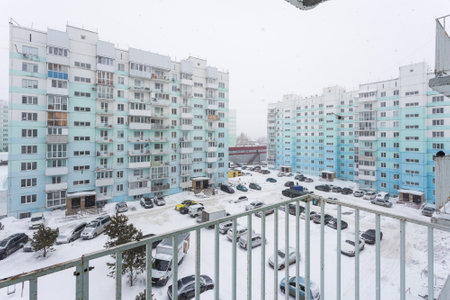 the balcony of an apartment on the upper floors of an apartment buildingの写真素材