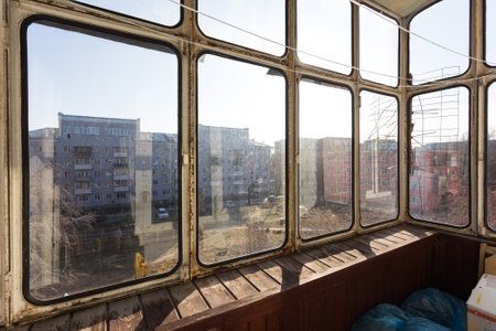 the balcony of an apartment on the upper floors of an apartment building