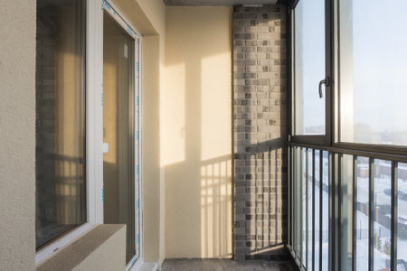 the balcony of an apartment on the upper floors of an apartment building