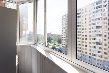 the balcony of an apartment on the upper floors of an apartment buildingの写真素材