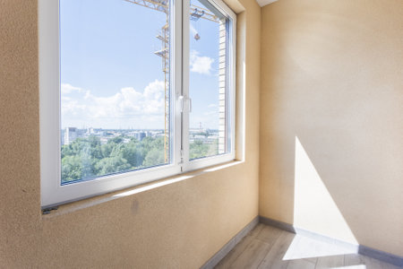 the balcony of an apartment on the upper floors of an apartment building