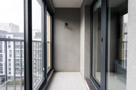 the balcony of an apartment on the upper floors of an apartment building