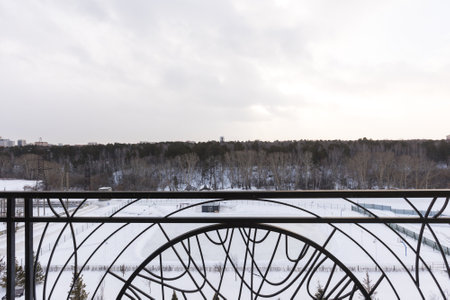 the balcony of an apartment on the upper floors of an apartment buildingの写真素材