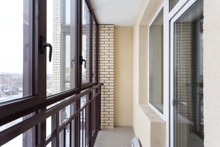 the balcony of an apartment on the upper floors of an apartment buildingの写真素材