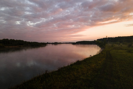 Beautiful sunset over the river in the summer. Landscape.の写真素材