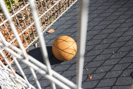 Basketball ball on a basketball court in the parkの写真素材