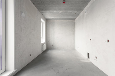 interior of the apartment without decoration in gray colors. rough finishの写真素材