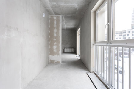 interior of the apartment without decoration in gray colors. rough finishの写真素材