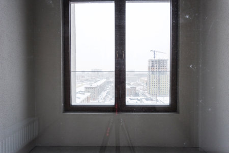 interior of the apartment without decoration in gray colors. rough finish