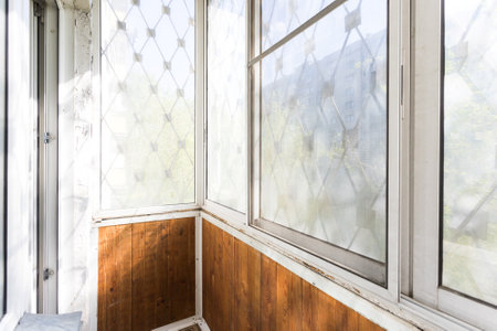 the balcony of an apartment on the upper floors of an apartment buildingの写真素材