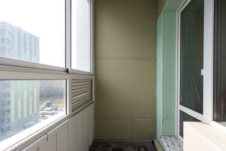 the balcony of an apartment on the upper floors of an apartment buildingの写真素材