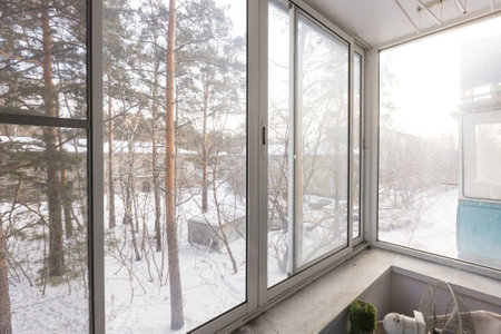 the balcony of an apartment on the upper floors of an apartment buildingの写真素材
