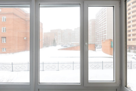 the balcony of an apartment on the upper floors of an apartment buildingの写真素材
