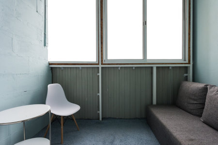 the balcony of an apartment on the upper floors of an apartment buildingの写真素材