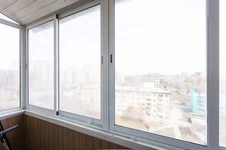 the balcony of an apartment on the upper floors of an apartment buildingの写真素材