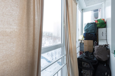 the balcony of an apartment on the upper floors of an apartment buildingの写真素材